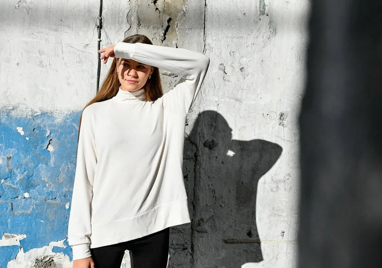 Women in urban activewear walking on a city street